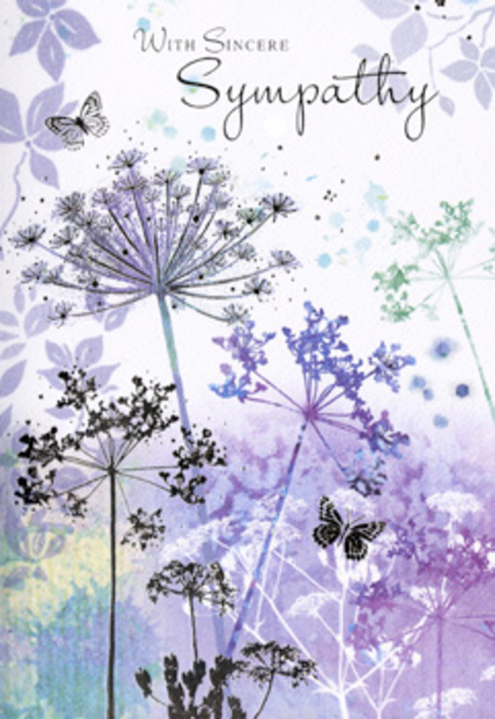 The illustration inside this sympathy card unfolds with the quiet grace of a Belvedere evening, when colours soften and sounds seem to hush. At the forefront, a cluster of slender wildflower stems rises from the lower border, each one curving gently upwards before opening into fine, umbelliferous heads. These delicate flower crowns are rendered in layered tones of lilac, dusky violet, and soft blue, interlaced with hints of muted sage and silvery green, so that each bloom feels both intricate and weightless. The petals and tiny florets are suggested rather than rigidly drawn, allowing the eye to drift across their airy silhouettes, as if watching tall grasses move in a light wind somewhere near Nuxley Road. Behind the flowers, a smooth wash of watercolour spreads across the card-pale purples, blue-greys, and faint greenish notes blending like morning mist over a distant landscape. The background remains out of focus, inviting attention back to the gentle dance of stems and blossoms. Among them, faint butterflies appear, their wings soft and translucent, embodying delicacy and the sense that something unseen but loving is close by. The lighting in the design is subdued and even, as though filtered through cloud, creating a mood of contemplation rather than drama. There is a subtlety here that echoes the thoughtful care of a Belvedere florist preparing funeral flowers: nothing is overstated, yet every detail is meaningful. For someone in Belvedere seeking to offer condolences, this card becomes a quiet companion, its floral imagery holding space for sorrow, remembrance, and a small flicker of hope.
